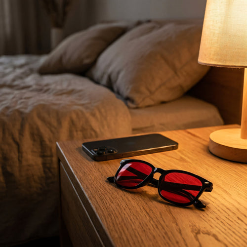 PAWIFI red lens glasses on a bedside table